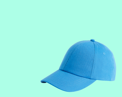 Olive green men's cap with a curved brim placed on a plain surface
